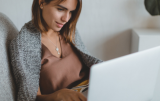 woman in bed on laptop