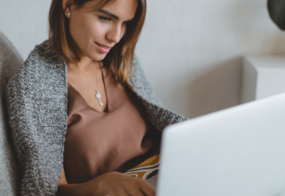 woman in bed on laptop