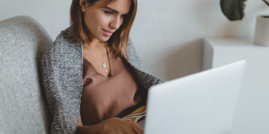 woman in bed on laptop