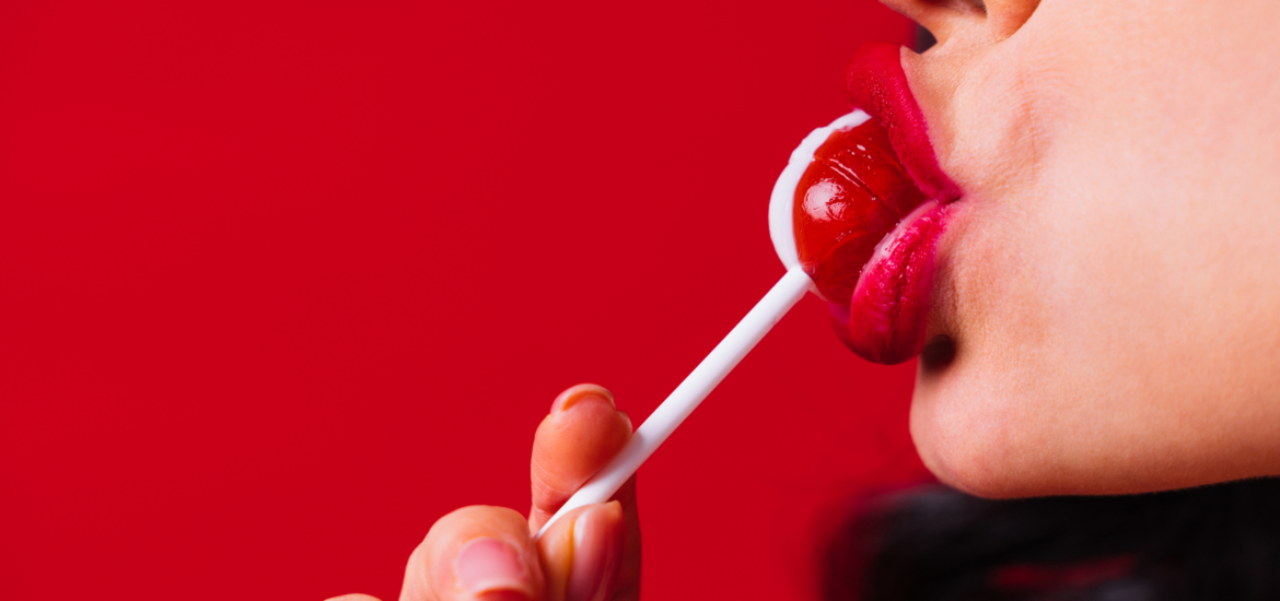 woman sucking a lollypop