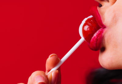 woman sucking a lollypop